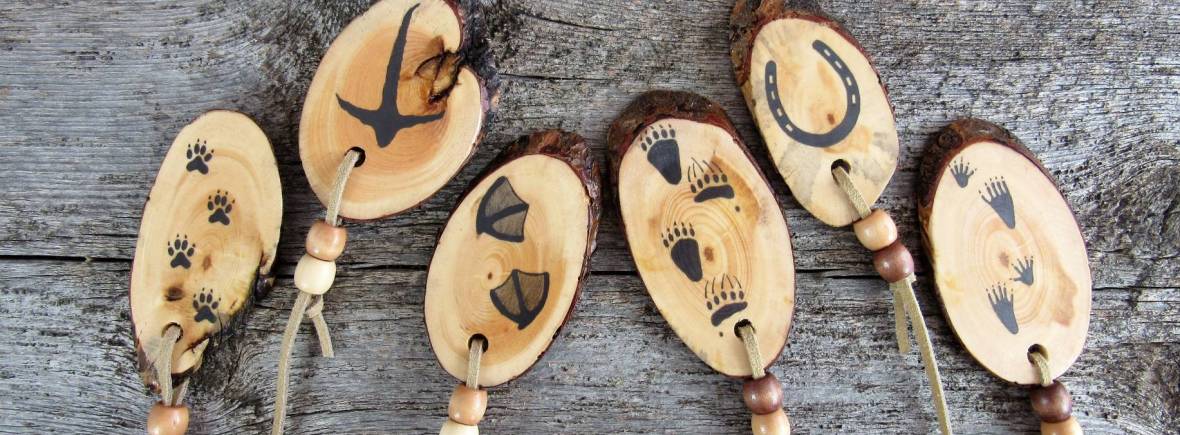 Wooden bookmarks with animal and bird tracks.