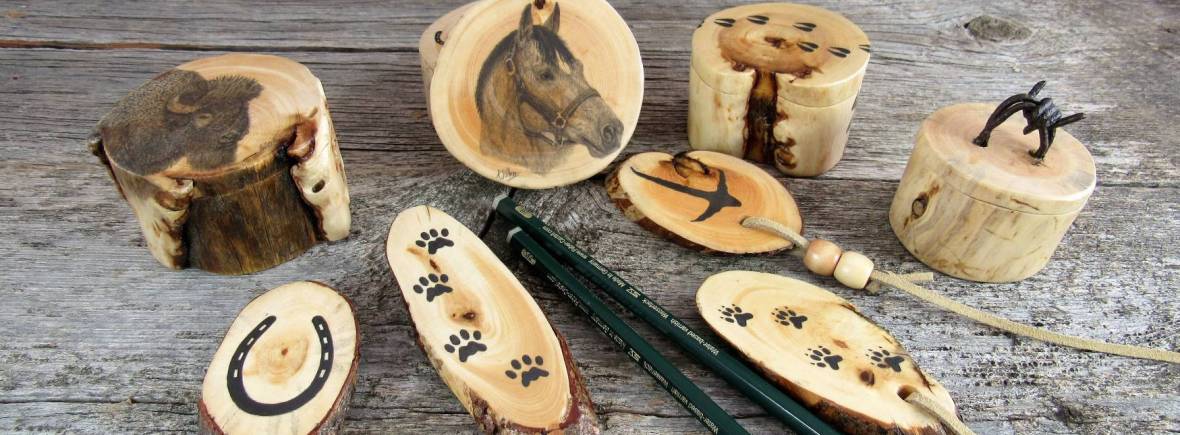Wooden ring boxes with a selection of bookmarks and fridge magnets.